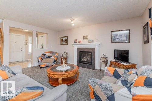 6227 5 Avenue, Edmonton, AB - Indoor Photo Showing Living Room With Fireplace