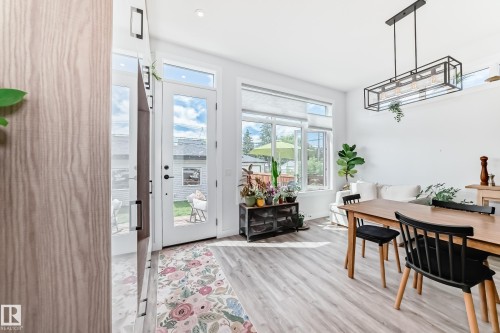 Doorway featuring wood finished floors - 8321 80 Avenue, Edmonton, AB - Indoor Photo Showing Dining Room