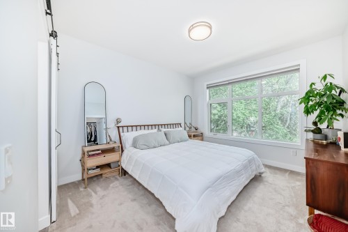 Carpeted bedroom with baseboards - 8321 80 Avenue, Edmonton, AB - Indoor Photo Showing Bedroom