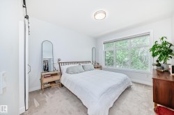 Carpeted bedroom with baseboards - 