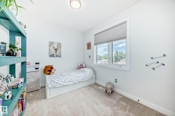 Bedroom with light carpet and baseboards - 