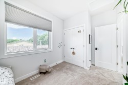 Unfurnished bedroom featuring carpet, attic access, and a closet - 