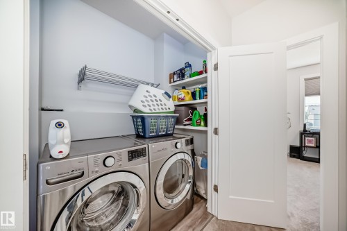 Washroom with washer and clothes dryer - 8321 80 Avenue, Edmonton, AB - Indoor Photo Showing Laundry Room