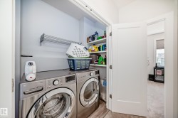 Washroom with washer and clothes dryer - 