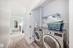 Washroom with separate washer and dryer, light colored carpet, and recessed lighting - 