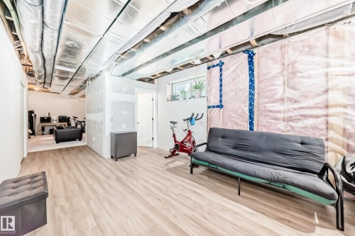 Unfinished basement featuring wood finished floors - 8321 80 Avenue, Edmonton, AB - Indoor Photo Showing Other Room