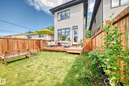 Back of property with a deck and a fenced backyard - 8321 80 Avenue, Edmonton, AB - Outdoor With Deck Patio Veranda