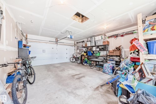 Garage featuring a garage door opener - 8321 80 Avenue, Edmonton, AB - Indoor Photo Showing Garage