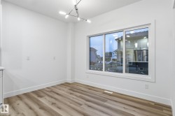 Empty room featuring baseboards and light wood-style flooring - 