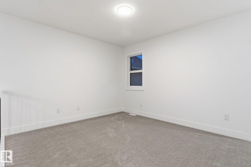Unfurnished room featuring carpet flooring and baseboards - 2532 210 Street, Edmonton, AB - Indoor Photo Showing Other Room