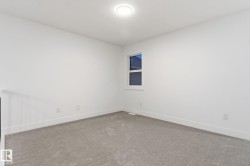 Unfurnished room featuring carpet flooring and baseboards - 