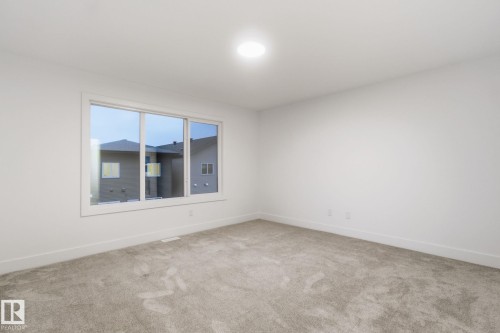 Empty room featuring light carpet and baseboards - 2532 210 Street, Edmonton, AB - Indoor Photo Showing Other Room