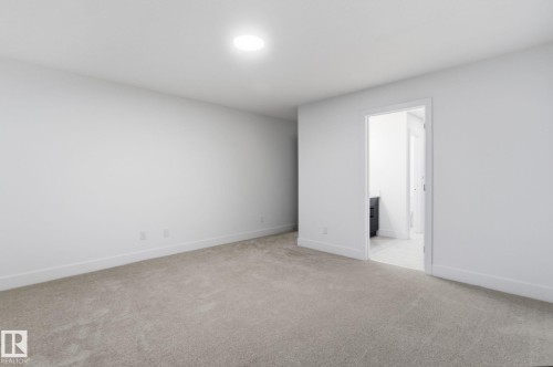 Empty room featuring light colored carpet and baseboards - 2532 210 Street, Edmonton, AB - Indoor Photo Showing Other Room