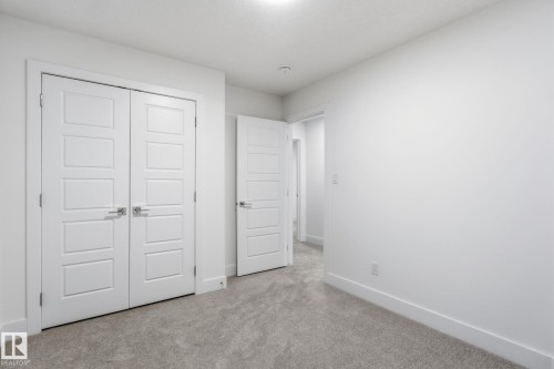 Unfurnished bedroom with carpet flooring and a closet - 2532 210 Street, Edmonton, AB - Indoor Photo Showing Other Room