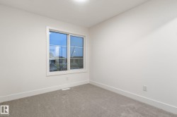 Spare room with baseboards and carpet floors - 