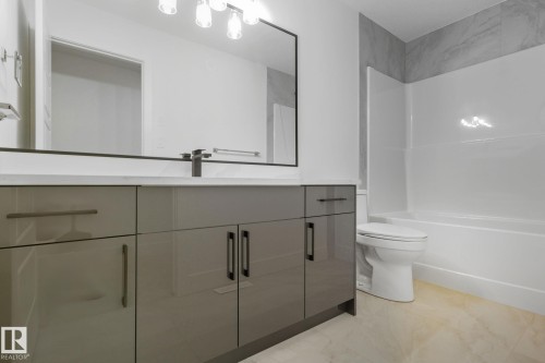 Bathroom with vanity and shower / bathtub combination - 2532 210 Street, Edmonton, AB - Indoor Photo Showing Bathroom