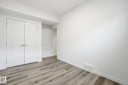Unfurnished bedroom featuring a closet and light wood-style flooring - 
