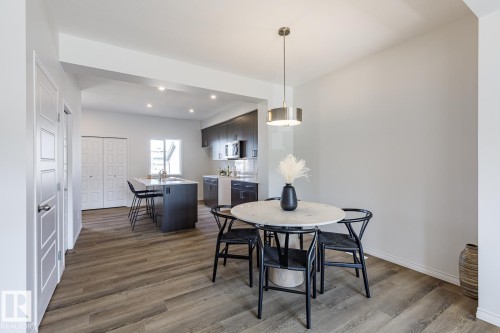 Dining room featuring recessed lighting and dark wood finished floors - 3617 Triomphe Boulevard, Beaumont, AB - Indoor Photo Showing Dining Room