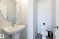 Bathroom with toilet and dark wood-style floors - 