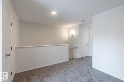 Unfurnished room featuring carpet and baseboards - 