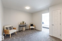 Sitting room featuring carpet floors - 