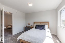 Carpeted bedroom with baseboards - 