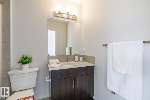 Bathroom with vanity and toilet - 3617 Triomphe Boulevard, Beaumont, AB - Indoor Photo Showing Bathroom