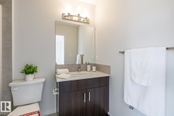 Bathroom with vanity and toilet - 