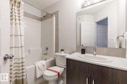 Bathroom with vanity and shower / bath combo with shower curtain - 