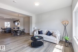 Living area with light wood-type flooring - 