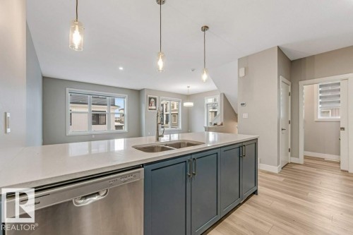 70 6905 25 Avenue Sw, Edmonton, AB - Indoor Photo Showing Kitchen With Double Sink