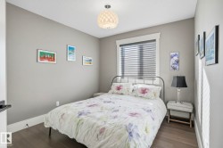 Bedroom featuring dark wood finished floors - 