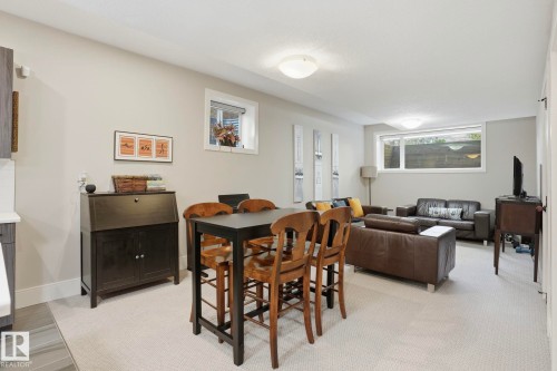 Dining area featuring light carpet and baseboards - 11121 81 Avenue, Edmonton, AB - Indoor