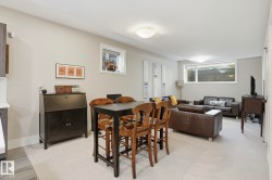 Dining area featuring light carpet and baseboards - 