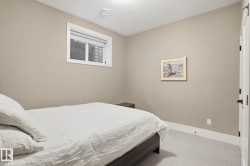 Bedroom featuring carpet flooring and baseboards - 