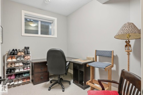 Home office featuring light carpet and a textured ceiling - 11121 81 Avenue, Edmonton, AB - Indoor Photo Showing Office