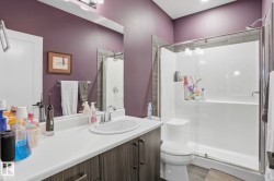 Bathroom featuring vanity and a shower stall - 