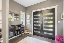 Bar with wood finished floors and french doors - 