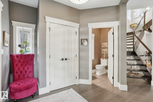 Foyer entrance with stairway and wood finished floors - 11121 81 Avenue, Edmonton, AB - Indoor Photo Showing Other Room