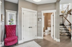 Foyer entrance with stairway and wood finished floors - 