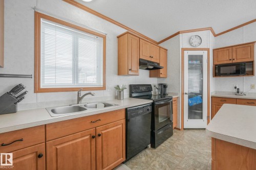 2055 Aspen Crescent, Leduc, AB - Indoor Photo Showing Kitchen With Double Sink
