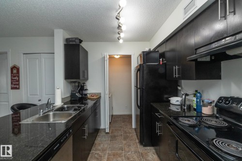 215 5810 Mullen Place, Edmonton, AB - Indoor Photo Showing Kitchen With Double Sink