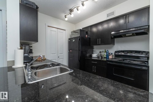 215 5810 Mullen Place, Edmonton, AB - Indoor Photo Showing Kitchen With Double Sink