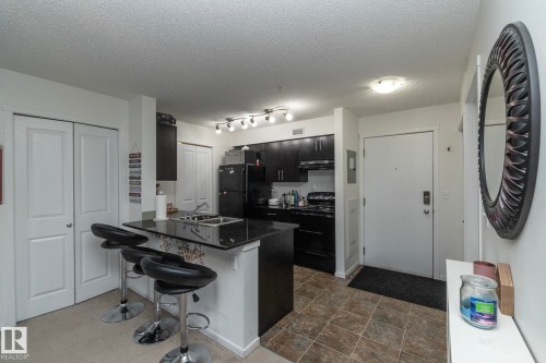 215 5810 Mullen Place, Edmonton, AB - Indoor Photo Showing Kitchen With Double Sink