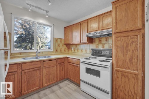5512 38B Avenue, Edmonton, AB - Indoor Photo Showing Kitchen With Double Sink