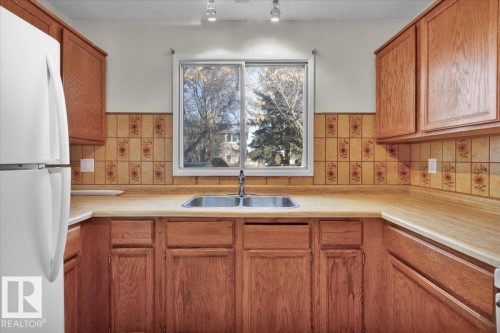 5512 38B Avenue, Edmonton, AB - Indoor Photo Showing Kitchen With Double Sink