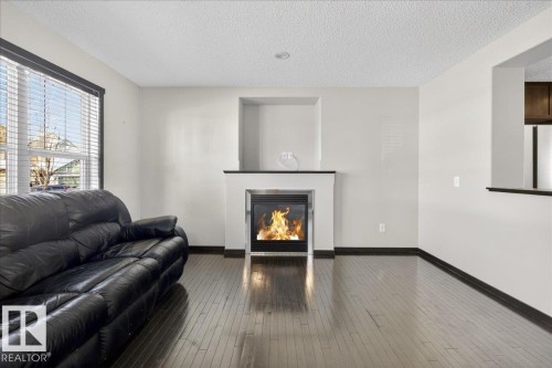 3623 13 Street, Edmonton, AB - Indoor Photo Showing Living Room With Fireplace
