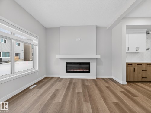 364 Bluff Cove, Leduc, AB - Indoor Photo Showing Living Room With Fireplace