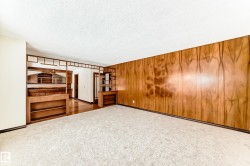 Unfurnished bedroom featuring carpet flooring and a textured ceiling - 