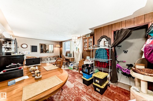 Living area featuring a textured ceiling - 12028 87 Street, Edmonton, AB - Indoor